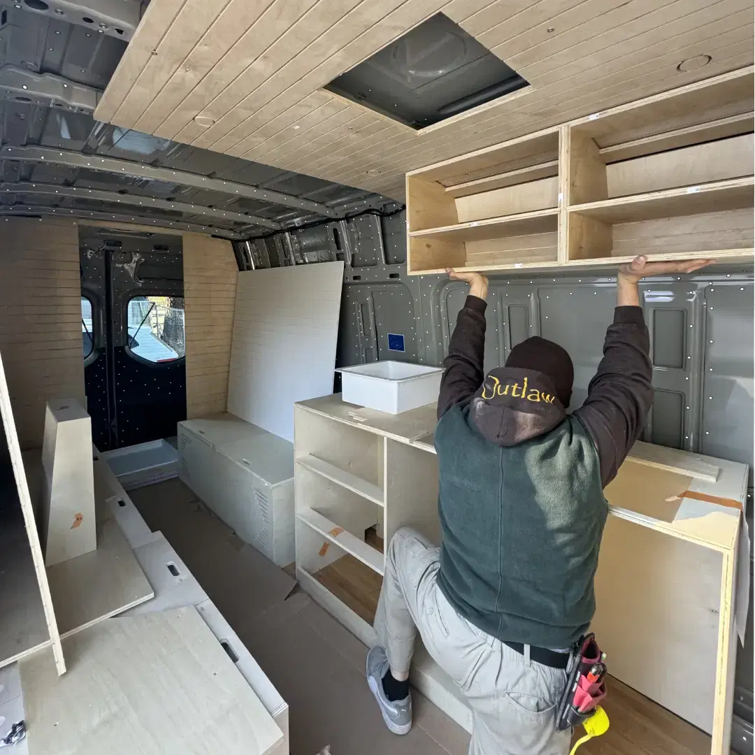 A camper van being built in a workshop